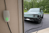 Rivian R1S charging with Velectr NACS to J1772 adapter at Tesla Destination Charger